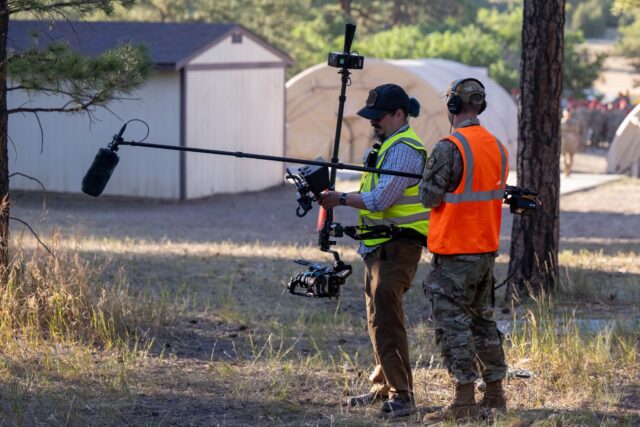 A couple more shots from last week, courtesy of Jason’s friend Dave who works at the Air Force Academy. The device I’m using in the photos is called a Tilta Float. The harness is hidden under the vest, and it probably weighs about 30-40lbs. It adds positional stability in the form of passive inertia, similar to a Steadicam, but with a gimbal attached for attitude stability and leveling (so more like the ARRI Trinity).
I’m at Nellis AFB in Las Vegas this week in *much* hotter temperatures, filming for another commercial, this one for the CSAF (top uniform officer in the Air Force). It’s going to be a fun, albeit hot, week out here, and we pulled out *all* the toys to really do this right. Stay tuned for more BTS from the 2AVS!